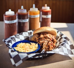 Image of a plate of BBQ and sauses